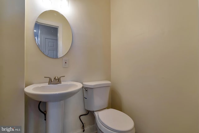 bathroom featuring toilet