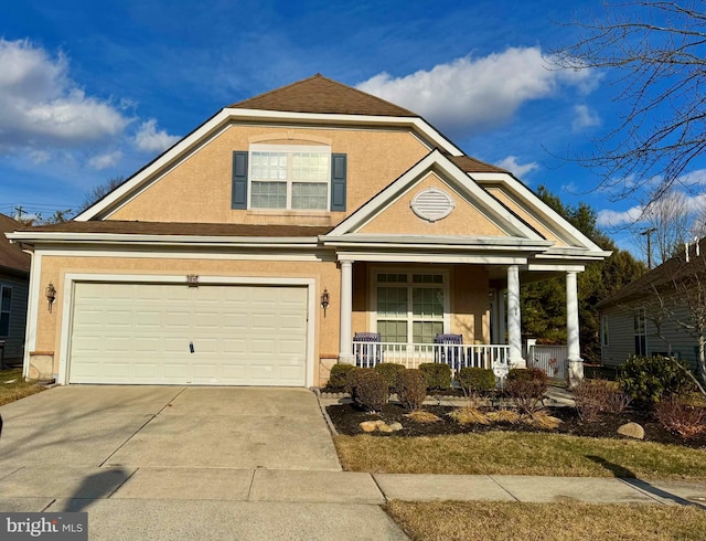 view of front of house featuring a porch and a garage