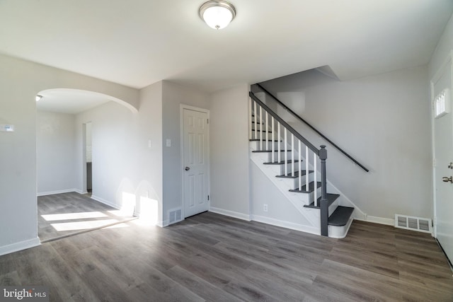 interior space with dark hardwood / wood-style flooring