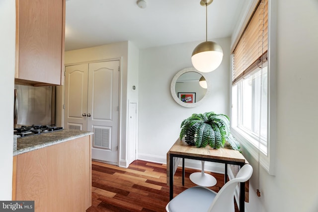 hall featuring dark wood-type flooring