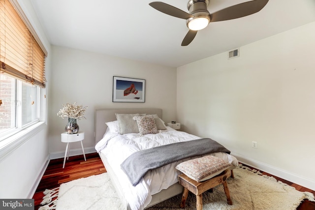 bedroom featuring ceiling fan and dark hardwood / wood-style floors