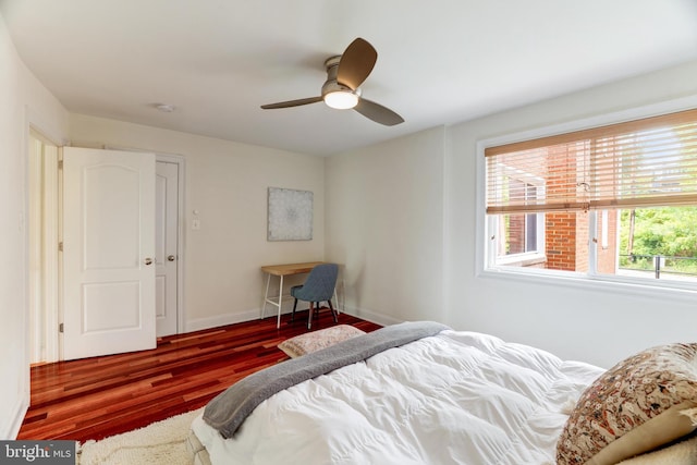 bedroom with dark wood-type flooring and ceiling fan