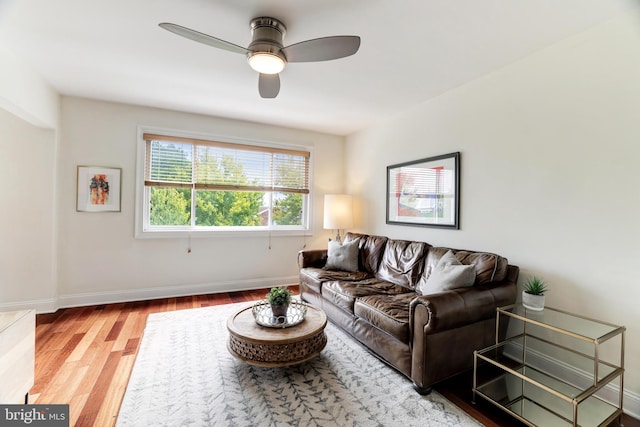 living room featuring hardwood / wood-style flooring and ceiling fan