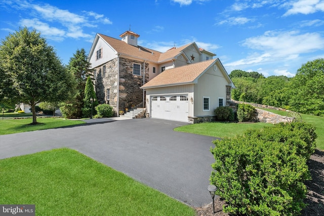 view of home's exterior featuring a garage and a lawn