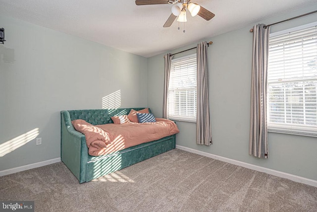 bedroom with ceiling fan and carpet flooring