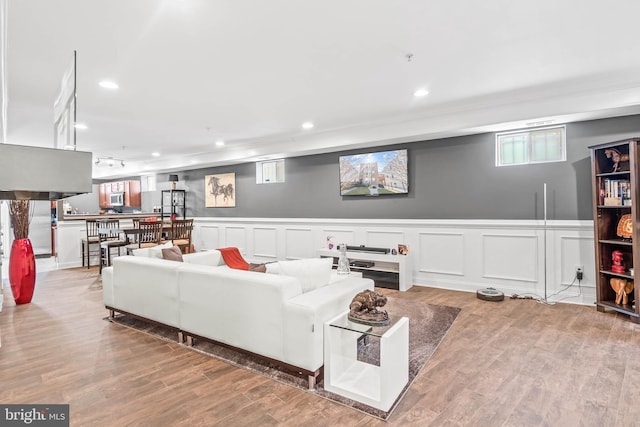 living room with light hardwood / wood-style floors