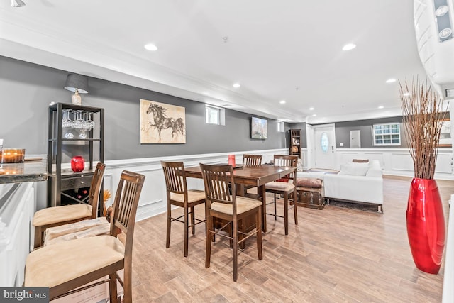 dining room featuring plenty of natural light and light wood-type flooring