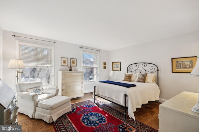 bedroom featuring parquet flooring