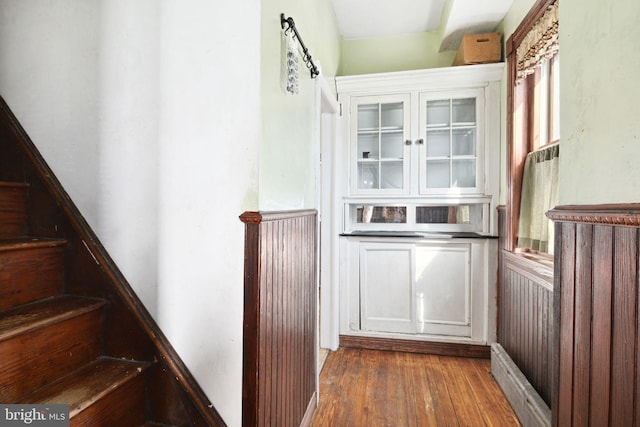 interior space featuring dark wood-type flooring and stairway