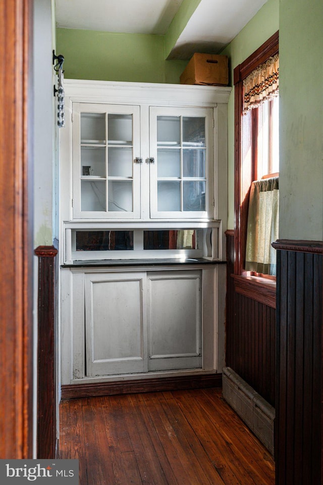 bar featuring dark wood finished floors