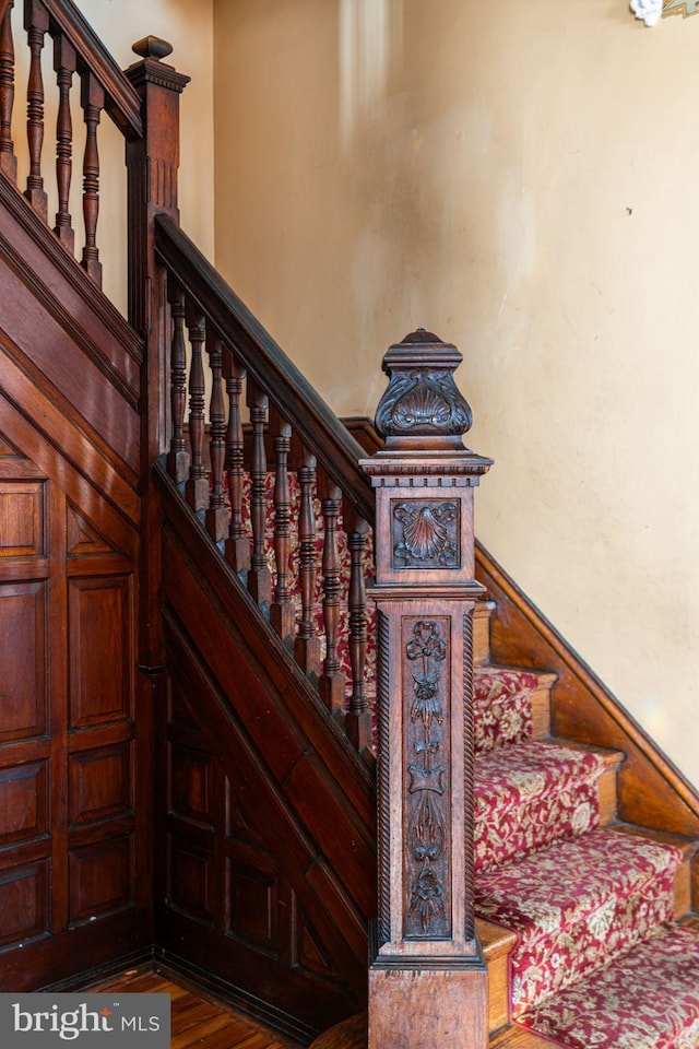 staircase featuring wood finished floors