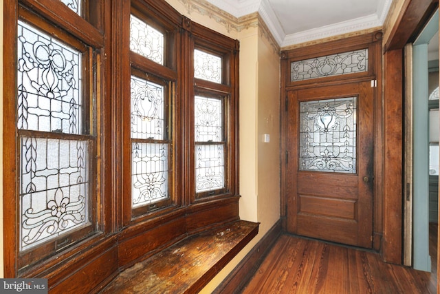 entryway featuring ornamental molding and dark wood-style floors