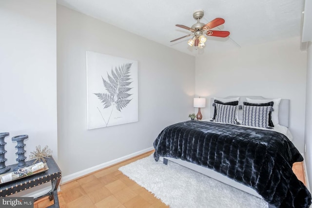 bedroom featuring hardwood / wood-style flooring and ceiling fan