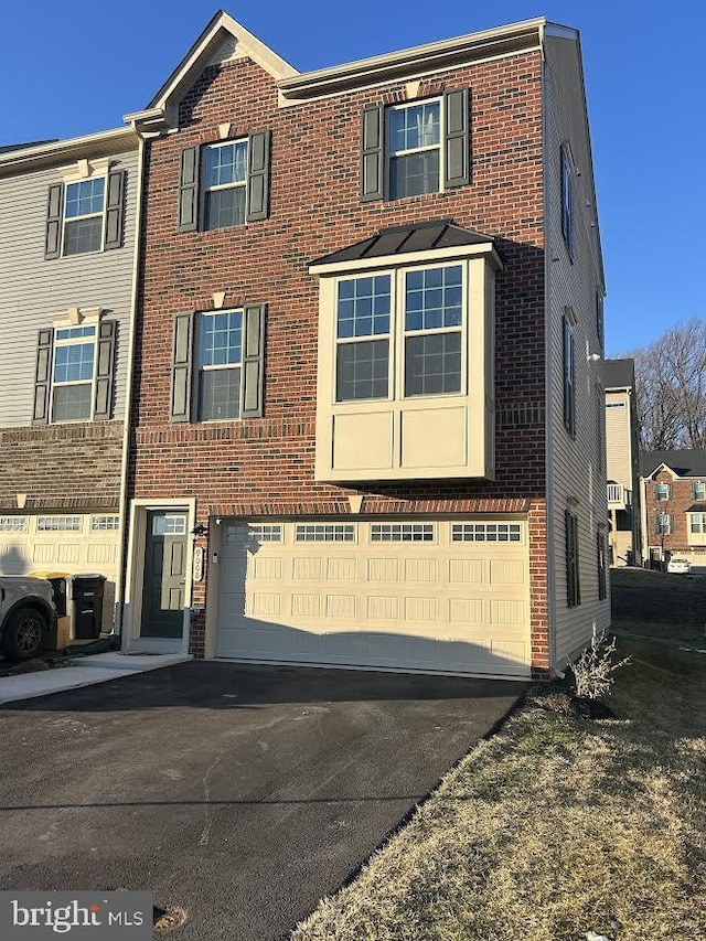 townhome / multi-family property featuring a garage