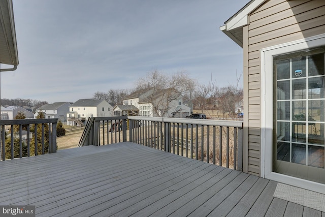 wooden deck featuring a residential view