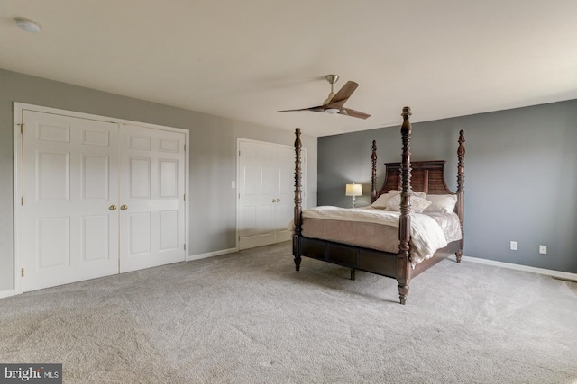 bedroom featuring a ceiling fan, light carpet, and baseboards