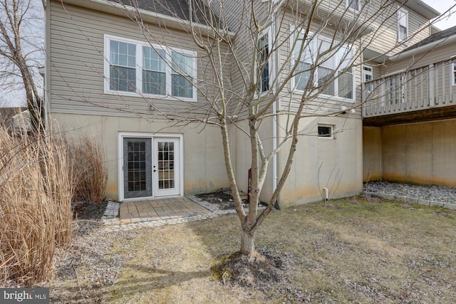 rear view of property with french doors