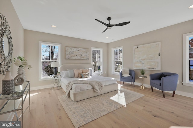 bedroom featuring light hardwood / wood-style flooring and ceiling fan