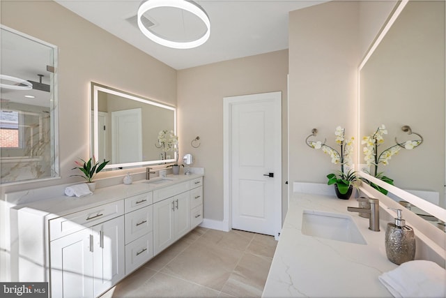 bathroom with tile patterned floors and vanity