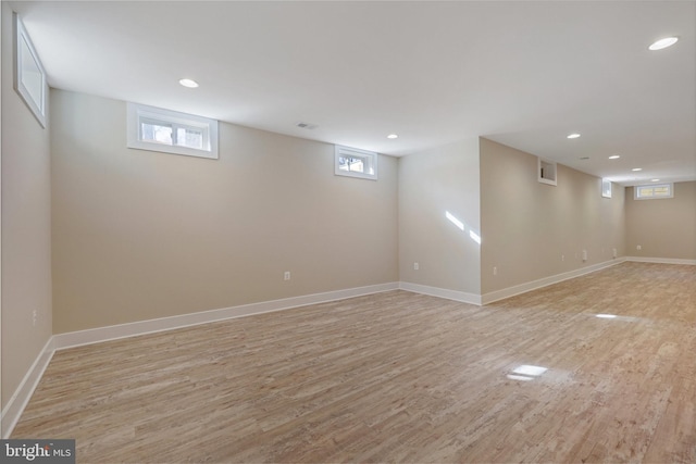 basement featuring light hardwood / wood-style flooring