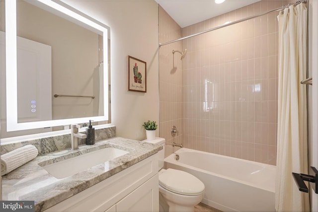 full bathroom featuring vanity, shower / bathtub combination with curtain, and toilet