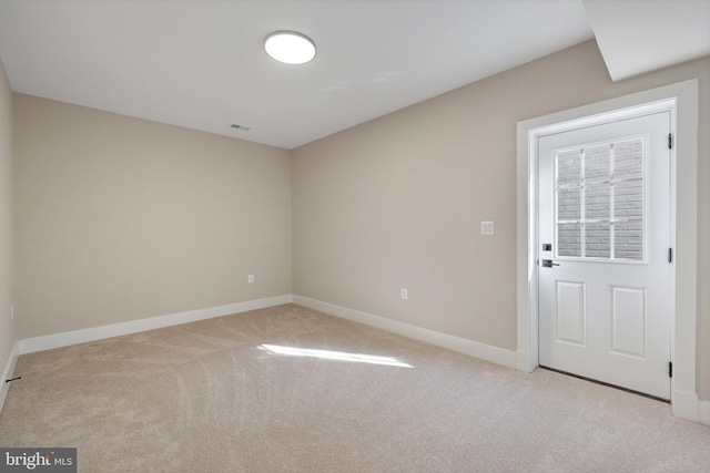 empty room featuring light colored carpet