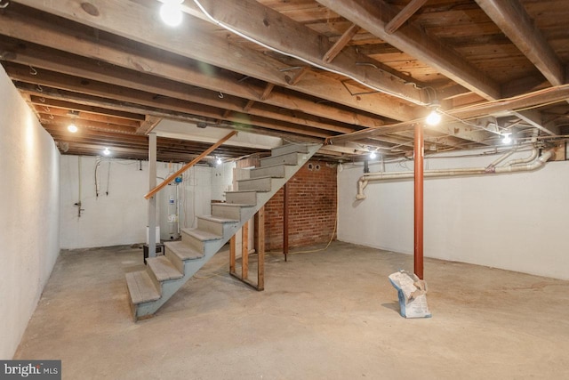 basement featuring electric water heater