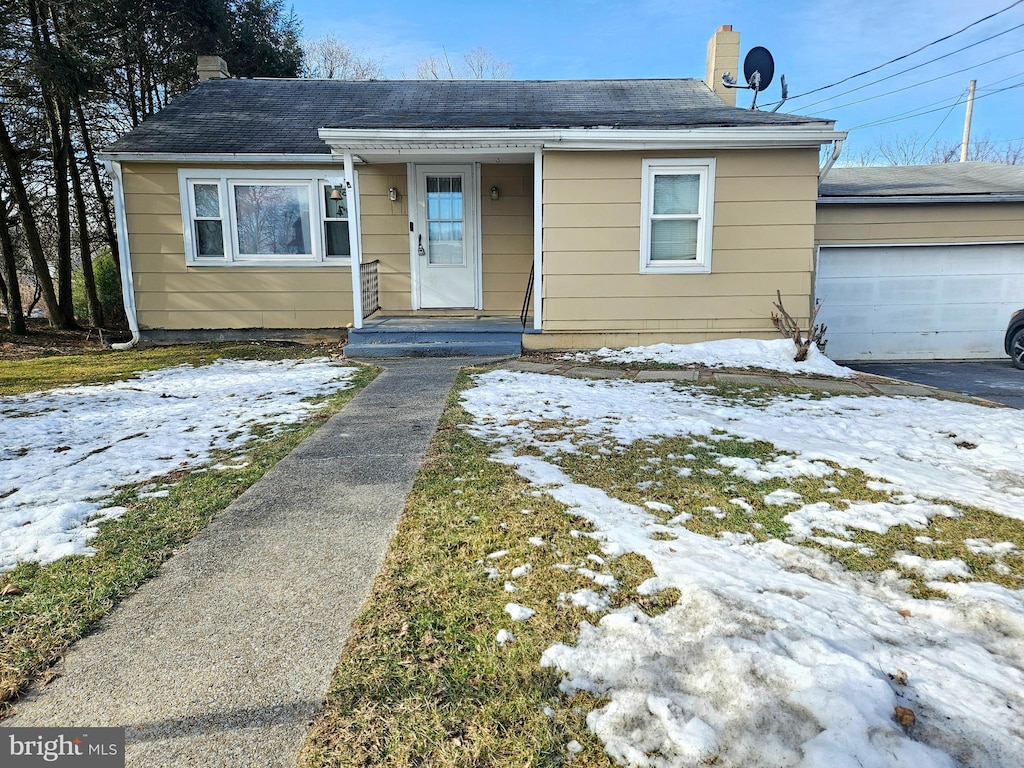 bungalow-style home with a garage