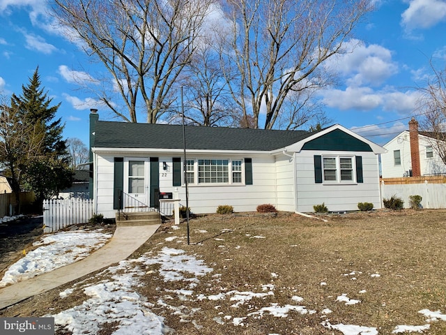 ranch-style home with a yard