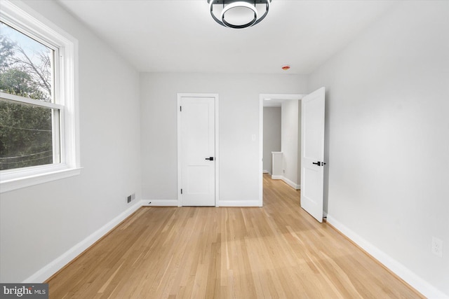 unfurnished bedroom with light hardwood / wood-style flooring