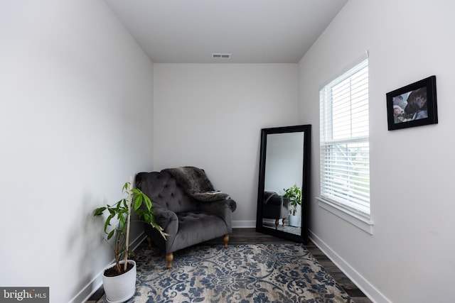 living area with dark hardwood / wood-style flooring