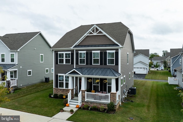 craftsman-style home featuring a porch, central AC unit, and a front lawn