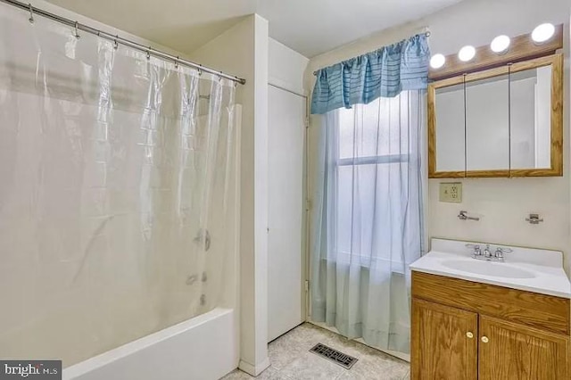 bathroom with vanity and shower / tub combo with curtain