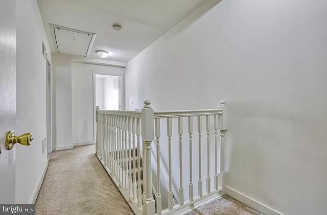 hallway featuring light carpet