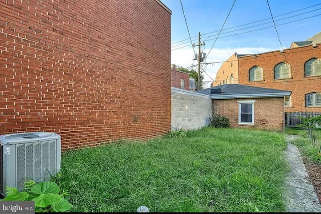 view of yard with central AC unit