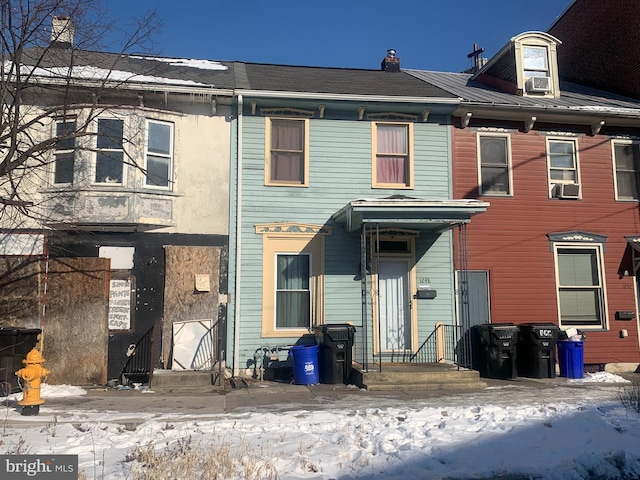 view of front facade featuring cooling unit