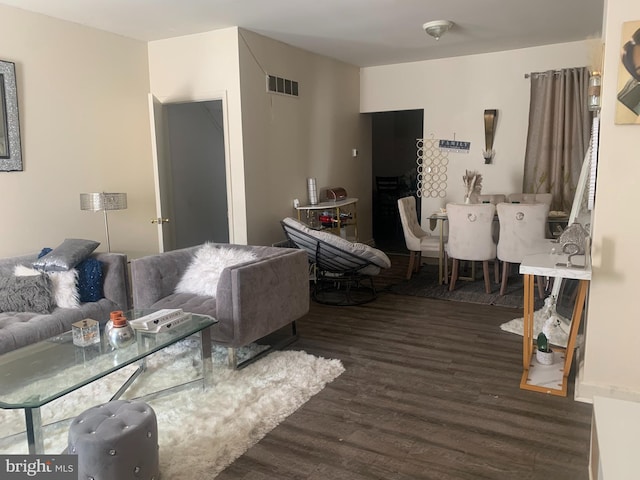 living room featuring dark hardwood / wood-style flooring