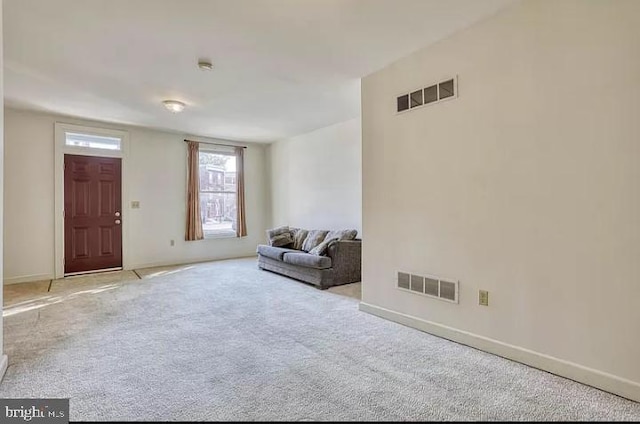 living area with light carpet