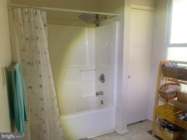 bathroom featuring tile patterned flooring and shower / bath combo with shower curtain