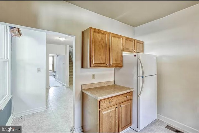 kitchen featuring white fridge