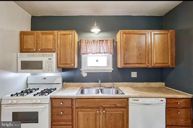 kitchen featuring sink and white appliances