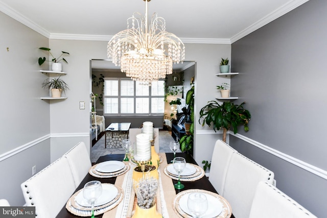 dining space with an inviting chandelier and ornamental molding