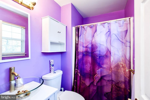 bathroom with vanity, toilet, and a shower with shower curtain