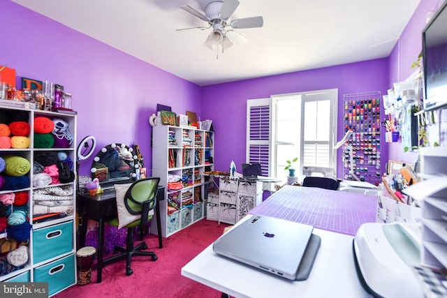 carpeted home office featuring ceiling fan