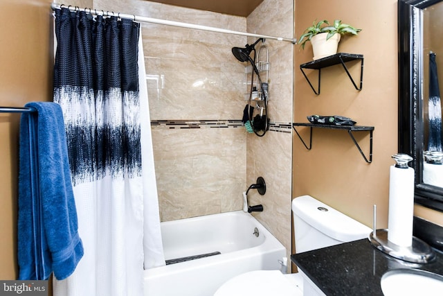 full bathroom featuring shower / tub combo with curtain, vanity, and toilet