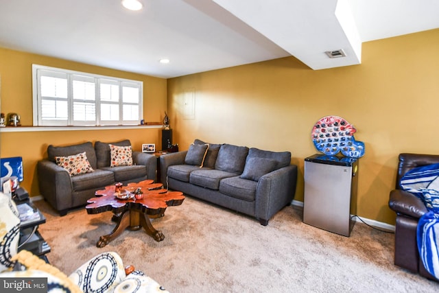 living room featuring light carpet