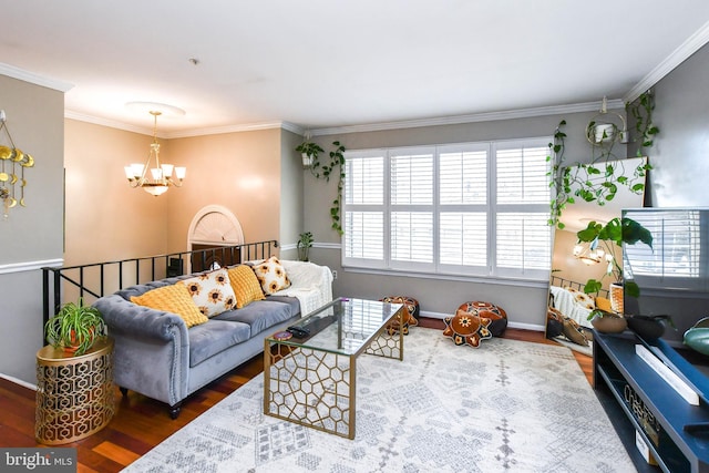 living room with crown molding, dark hardwood / wood-style flooring, and a notable chandelier