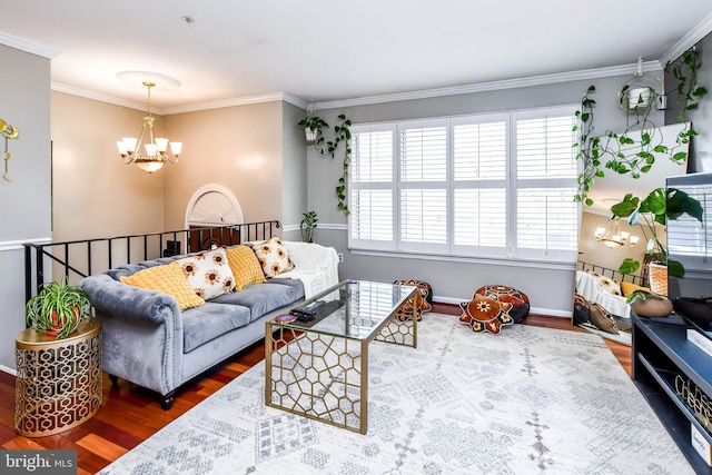 living room with an inviting chandelier, ornamental molding, and dark hardwood / wood-style floors