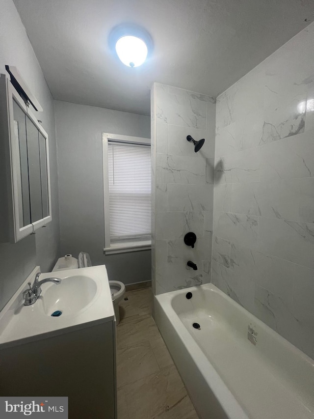 full bathroom with vanity, toilet, and tiled shower / bath combo