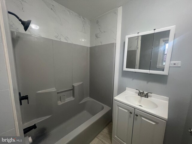 bathroom featuring vanity and shower / bathing tub combination